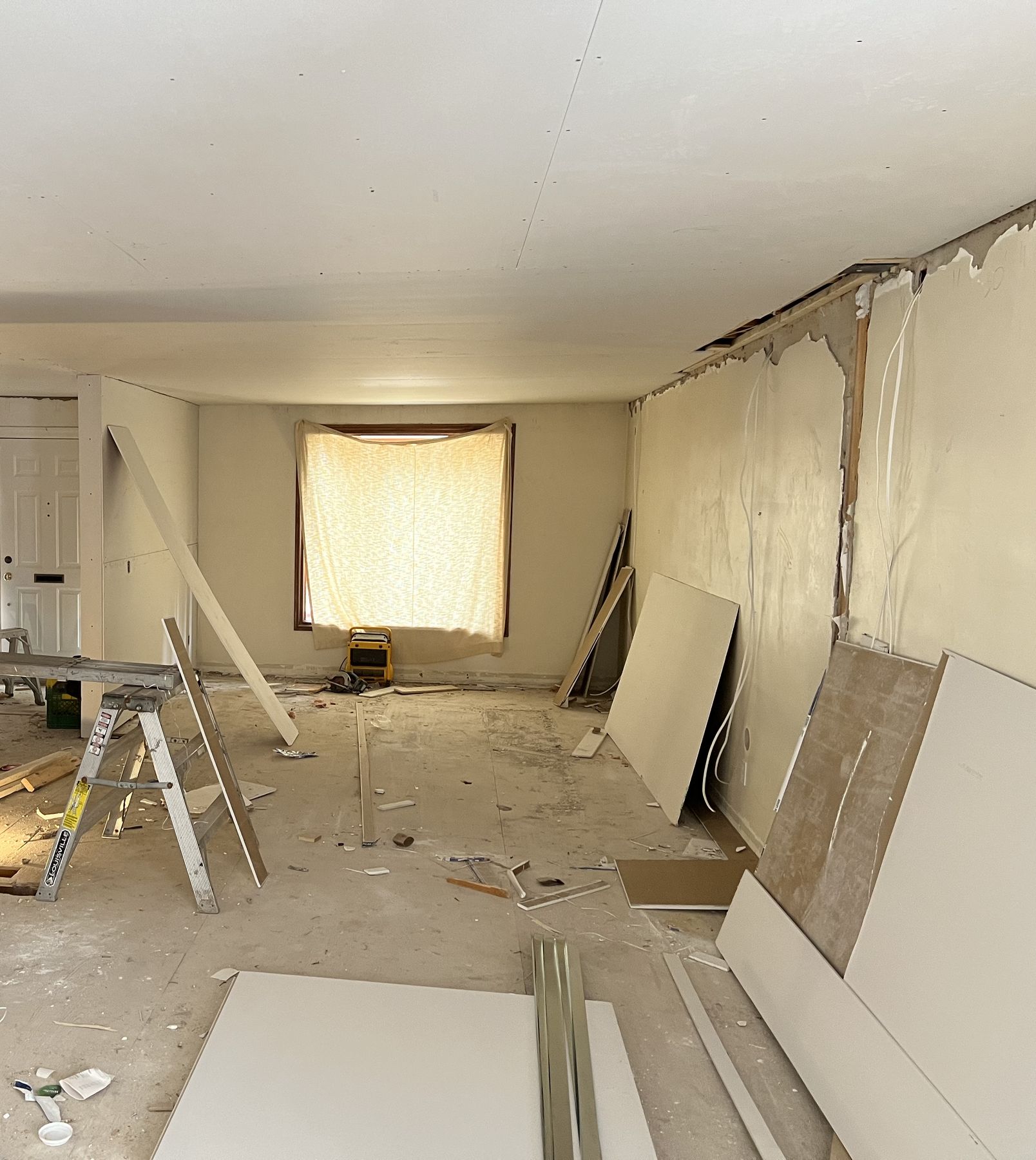 New drywall going up on the opened main floor
